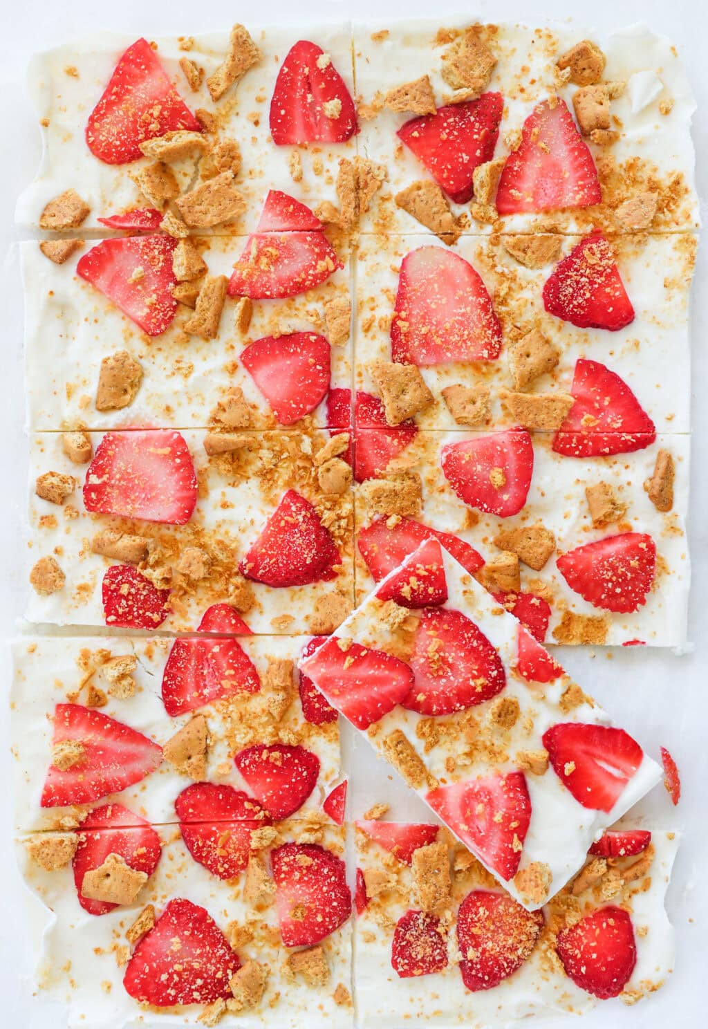 High Protein Frozen Greek Yogurt Cheesecake Bark with Strawberries cut into pieces