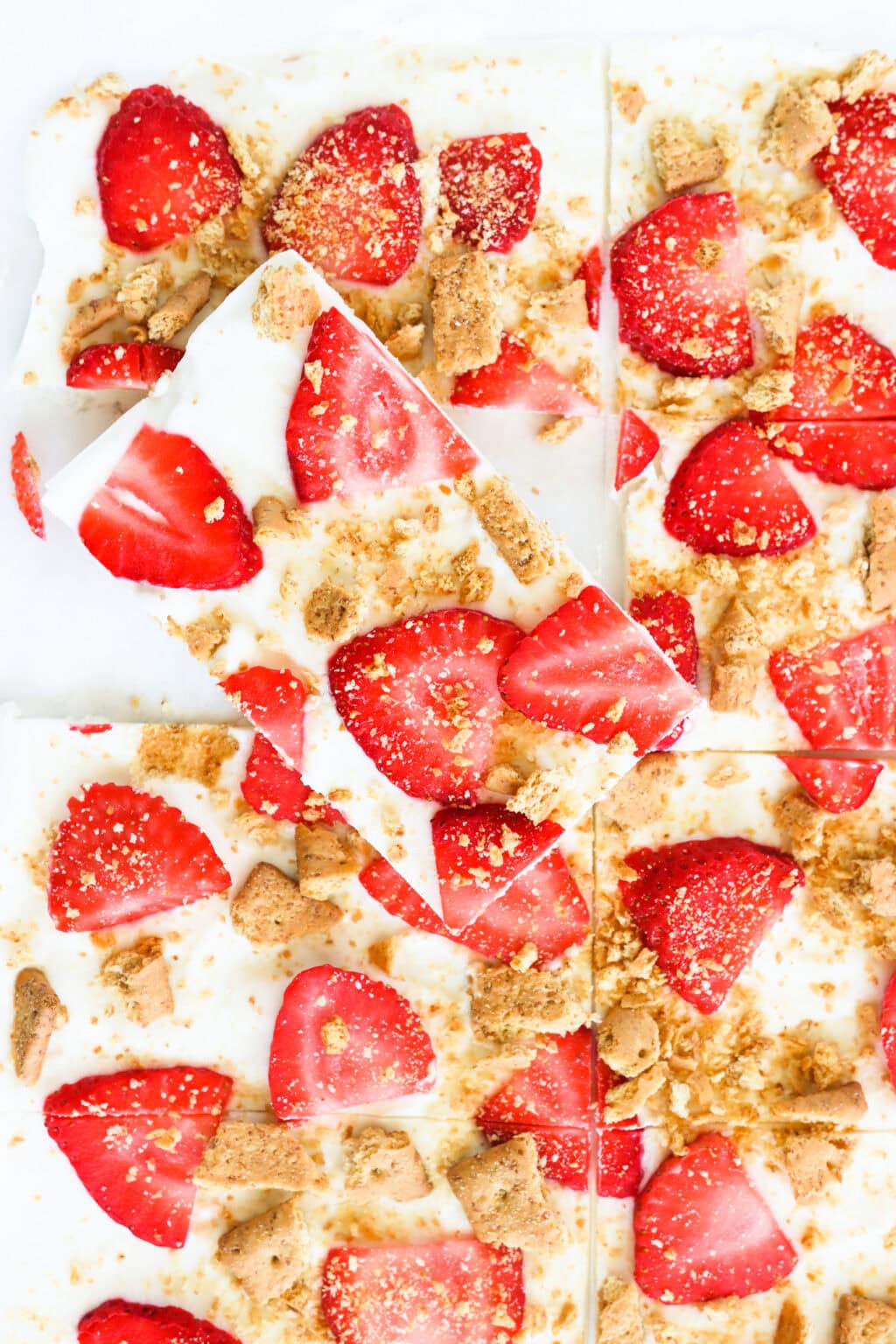 High Protein Frozen Greek Yogurt Cheesecake Bark with Strawberries cut into pieces