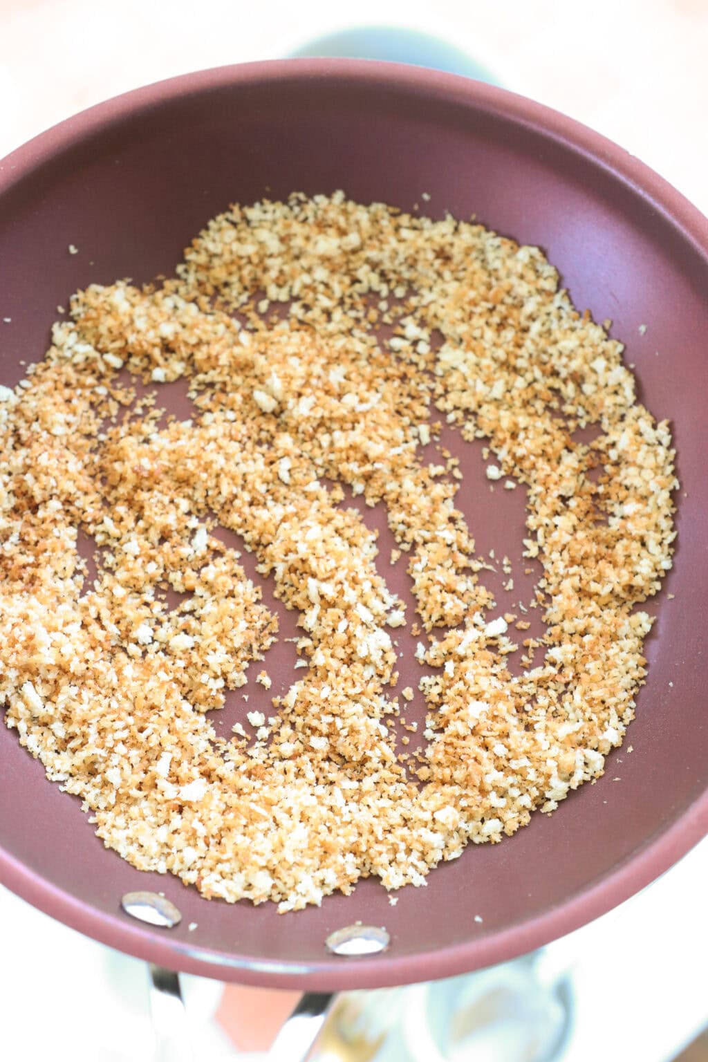 Panko bread crumbs in a red pan