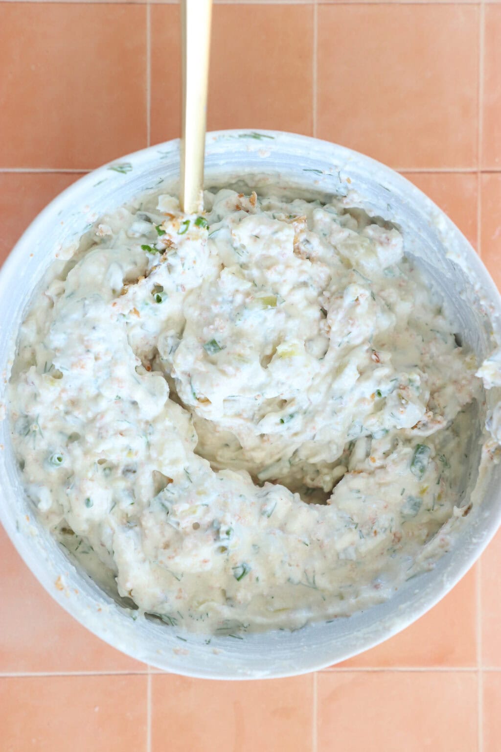 Ingredients for Seriously Good "Fried" Pickle Dip with Greek Yogurt mixed in a while bowl