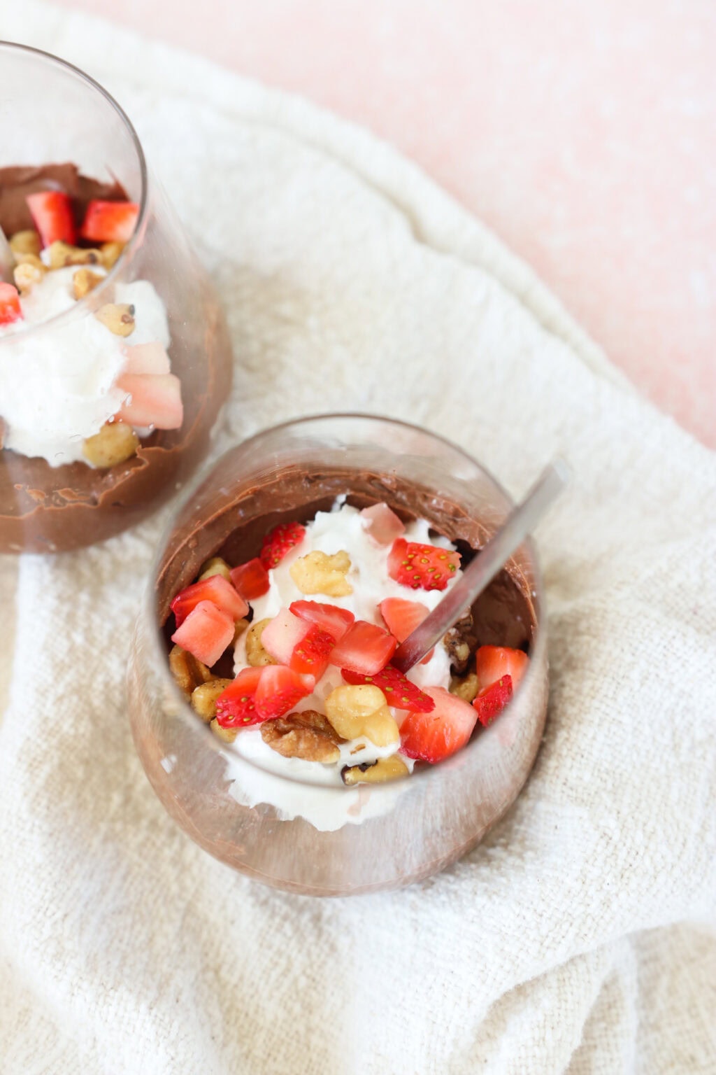 5-Minute Cottage Cheese Chocolate Mousse in a glass cup with strawberries and walnuts